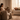 Woman relaxing at home beside a scented candle, illustrating how fragrance can influence mood and wellbeing.
