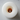 A birds eye view of a white column candle that has tunnelled.