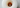 A birds eye view of a white column candle that has tunnelled.